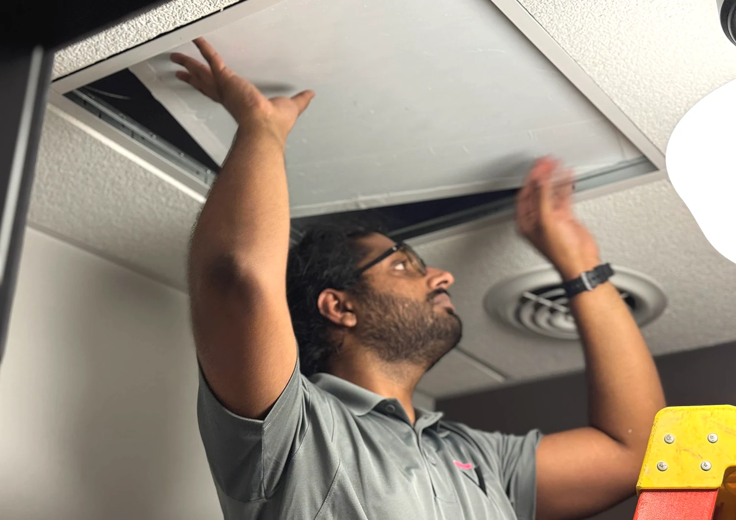 Technician working with a ceiling installation